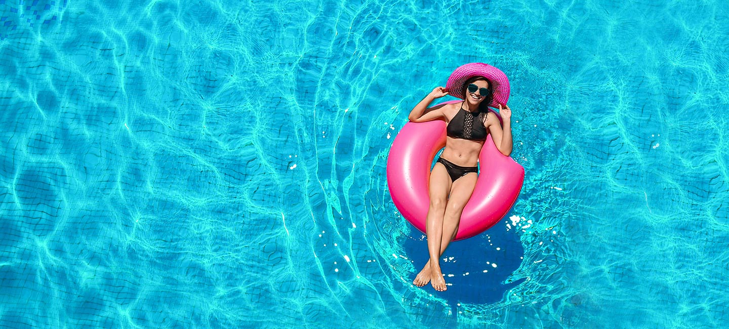 girl floating in a pool