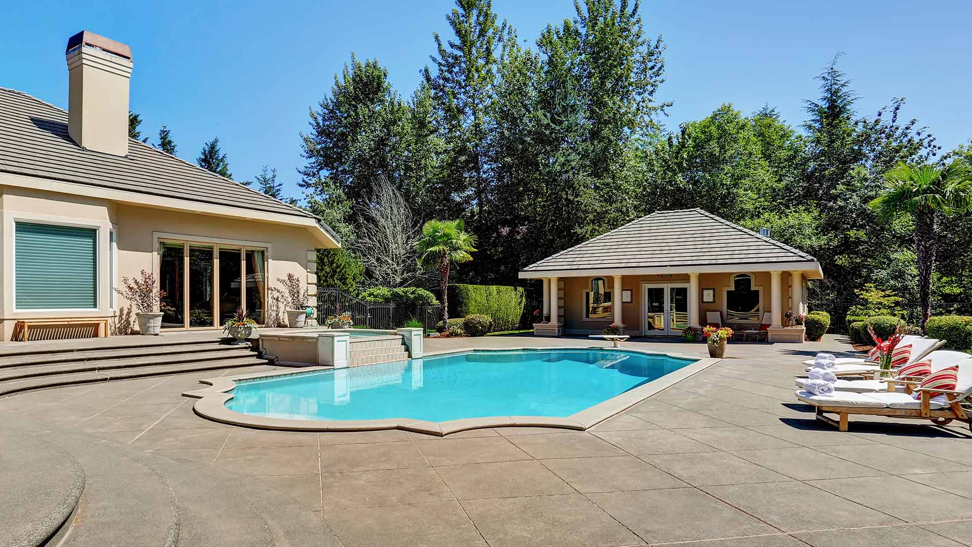 large patio and pool in backyard austin ar